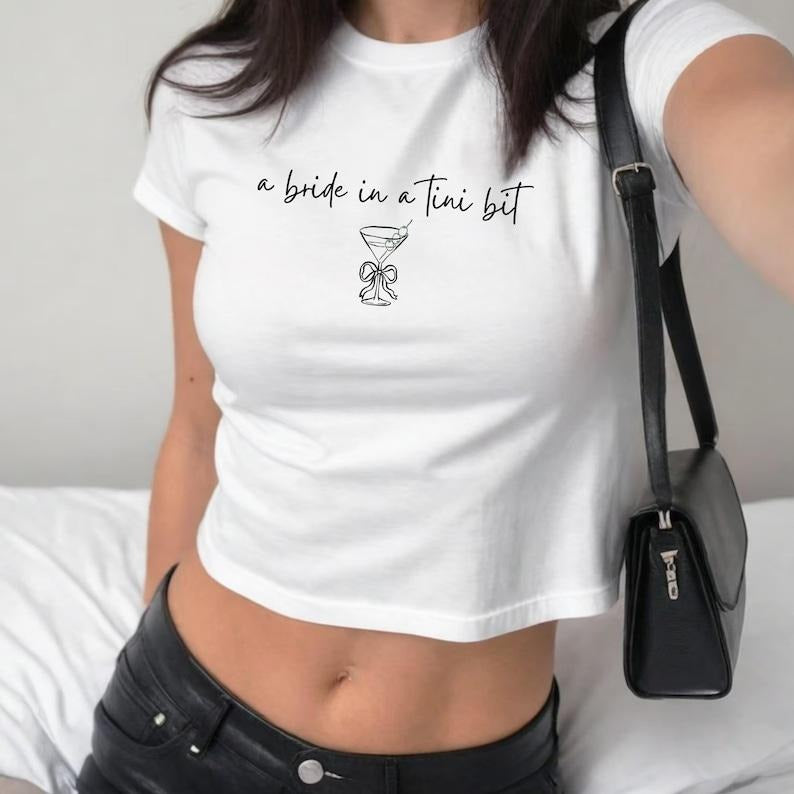 A Bride in a Tini Bit Womens Baby Tee, Bachelorette Shirt for Bride, Cute Martini Bride Top, Y2K Bridal Shower Apparel, Espresso Martini Tee