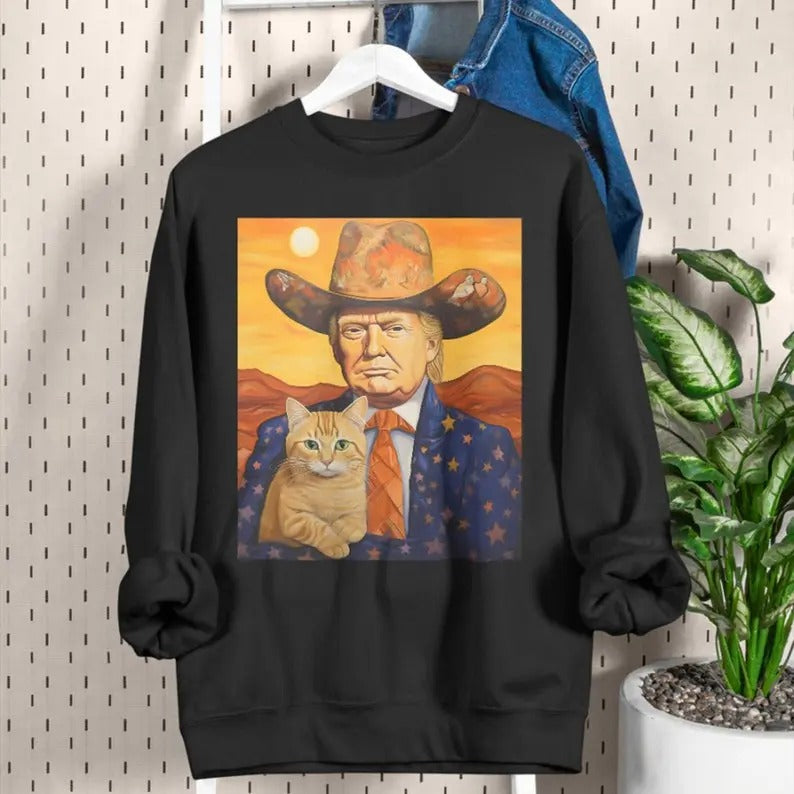 Cowboy Trump With a Cat T-shirt - Funny Trump Shirt - Donald Trump Shirts - Funny Cat Shirts - Sarcastic Gift For Trump and Cat Lovers sweater and hoodie