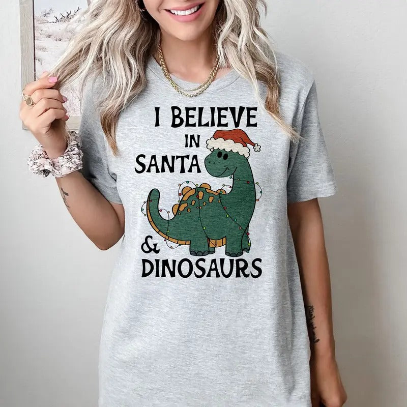 I believe in Santa and Dinosaurs - T-Shirt - Print is Sublimation, Unisex T-Shirt, Funny Tee,Gift Idea, Womenswear Graphic Top Cute