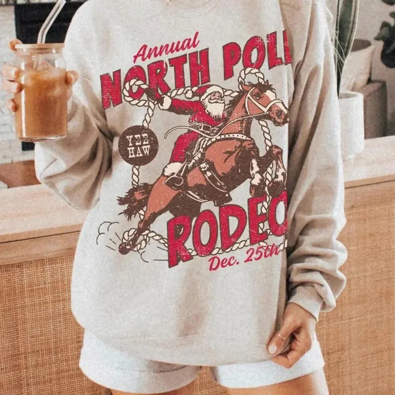 North Pole Rodeo Crewneck UNISEX Country Christmas Western Christmas Cowboy Santa Claus Shirt Vintage Groovy Festive Sweatshirt Santa Rodeo