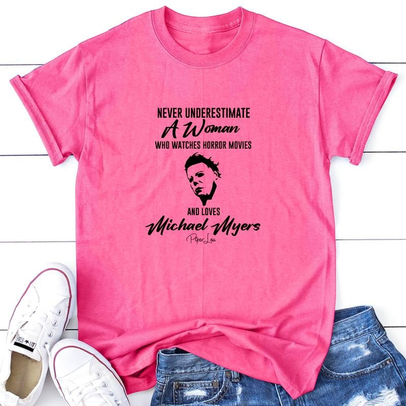 Never Underestimate A Woman Who Watches Horror Movies Apparel, Printed In The USA, Tee / Tank / V Neck Gray / White / Blue / Hot Pink / Orange, #sassy #cute #blackprint #100%cotton