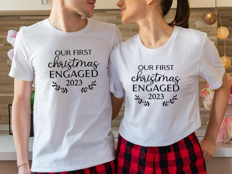 Our First Christmas Engaged 2023 Shirt, Matching New Engaged Couple Xmas T-Shirt, Engagement Gift Holiday Tee, Fiancรฉ And Fiancรฉe Christmas Outfit.