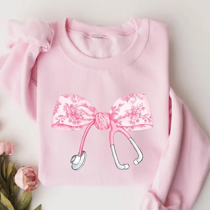 Pink Coquette Nurse Stethoscope Bow Sweatshirt, Gift for Nurse, Bow Oversized Shirt Fabric Womenswear nurse sweatshirt