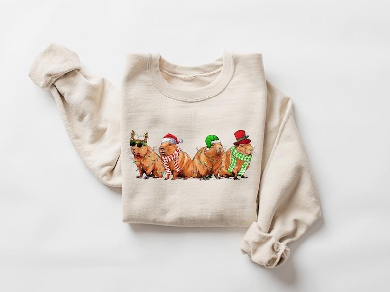 Capybara Merry Christmas Sweatshirt, Capybara Santa Xmas Lights Sweater, Capybara Lover Gift, Christmas Animals Shirt, Christmas Gifts, Hoodie and Sweater; T-shirt Cotton Menswear