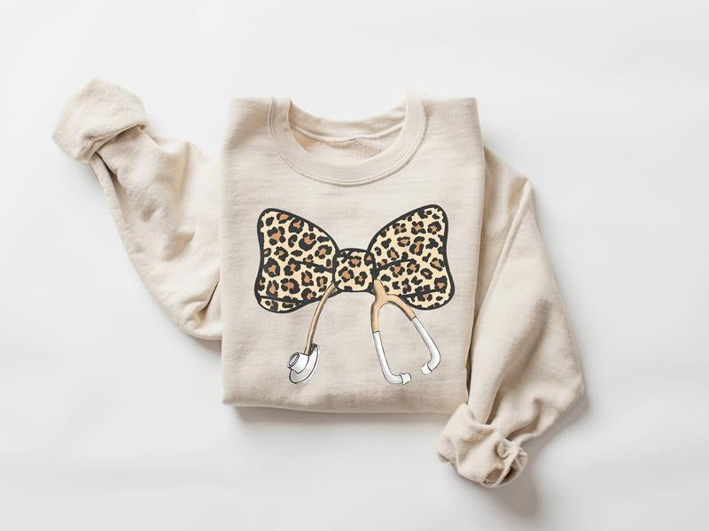 Coquette Nurse Stethoscope Bow Sweatshirt, Leopard Nurse Sweatshirt, Nurse Bow Sweater, Gift For Nurse, Bow Oversized Shirt, Nurse Appreciation, Nurse Shirt, Leopard Bow Shirt
