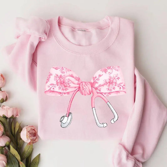 Coquette Pink Nurse Stethoscope Bow Sweatshirt, Pink Floral Nurse Sweatshirt, Nurse Bow Sweater, Gift For Nurse, Pink Bow Shirt, Nurse Appreciation Shirt, ER RN Nurse Shirt, Christmas Gift For Nurse