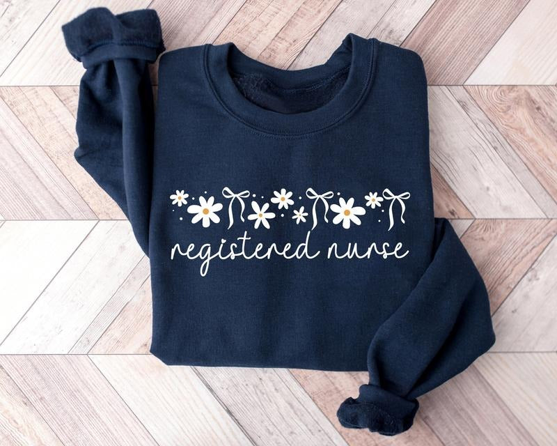 Daisy RN Nurse Sweatshirt, Floral Registered Nurse Nurse Sweater, Nurse Shirt, Nursing Crewneck, Registered Nurse Shirt, Graduation Gift For New Nurse, Nurse Day, Nurse Week Gift, Nurse Shirt, RN Tee