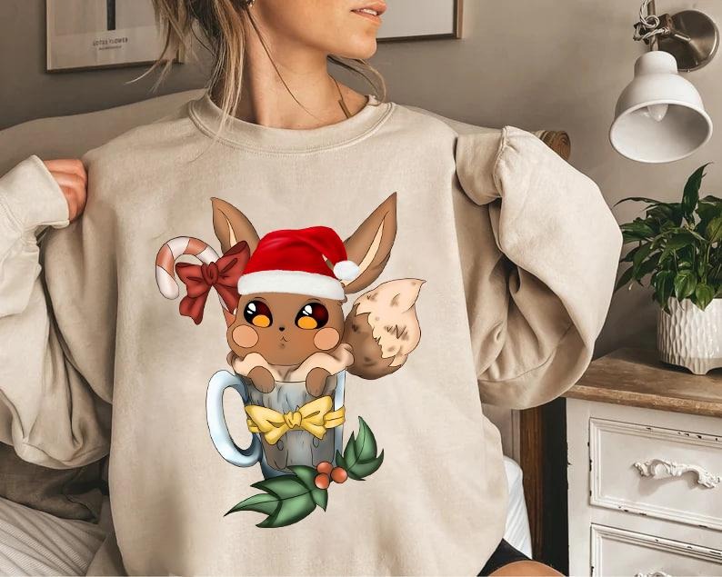Eevee Christmas Sweatshirt Tshirt Hoodie, Cute Eevee Sweatshirt for Gamers, Pokemon Christmas Sweater, Eevee Xmas Sweater, Eevee Santa Christmas Shirt, Eevee Evolutions Sweatshirt, Festive Christmas Sweater, Cozy Gaming Apparel, Christmas Eevee Shirt