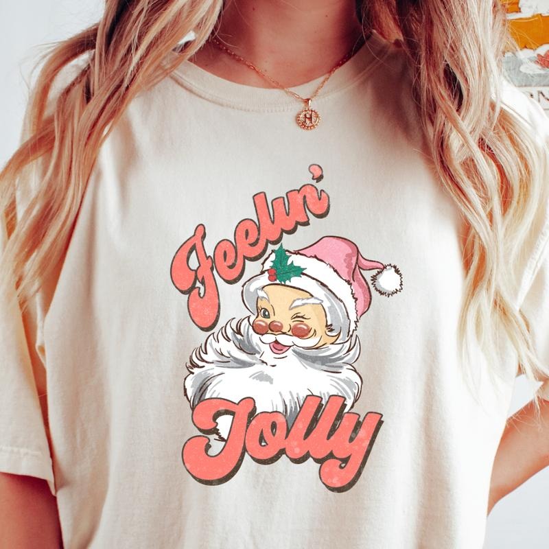 FEELIN JOLLY SANTA T-SHIRT (COMFORT COLORS T-SHIRT, CASUAL SHIRT UNISEX, CHRISTMAS CLOTHING, GRAPHIC APPAREL, HOLIDAY SHIRT) Cotton Fabric