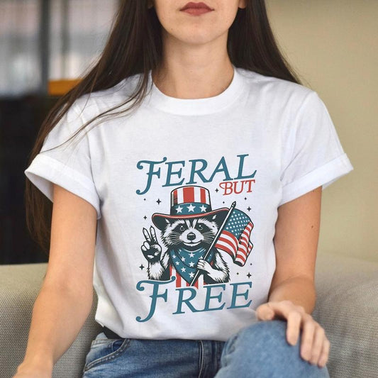 Feral But Free Funny Fourth of July Racoon TShirt, Patriotic Independence Day Gifts, USA Flag Print Unisex Cotton T-Shirt
