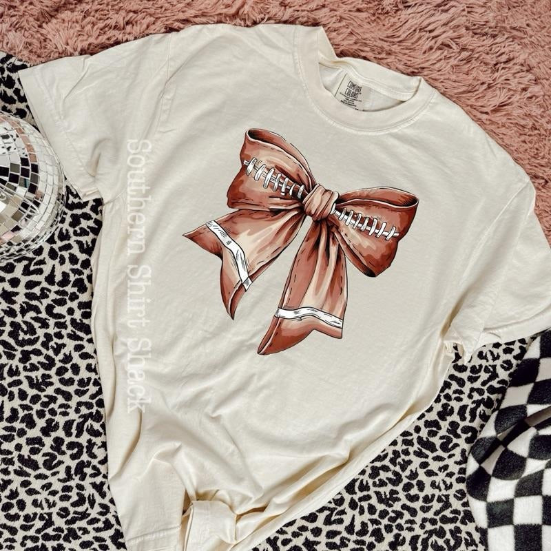 Football bow | ivory comfort colors t shirt