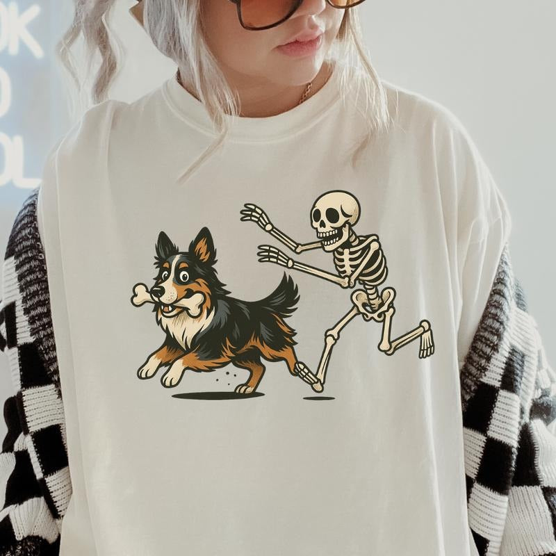 Funny Skeleton Chasing Australian Shepherd Dog Halloween T-Shirt | Spooky Graphic Tee Comfort Colors Style