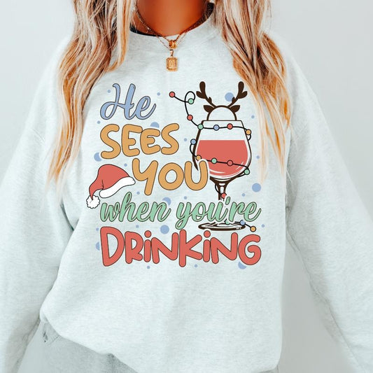 HE SEES YOU WHEN YOUR DRINKING CREWNECK (Crewneck Sweatshirt, Unisex Fit, Causal Sweatshirt for Christmas, Christmas Holiday Sweatshirt) Womenswear Hoodie