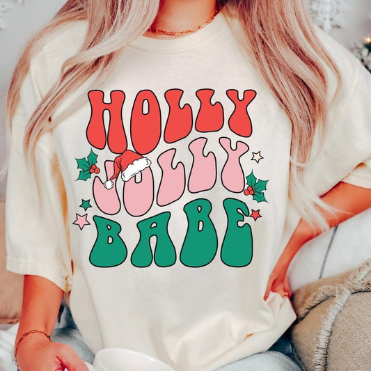 HOLLY JOLLY BABE T-SHIRT (COMFORT COLORS T-SHIRT, CASUAL SHIRT UNISEX, CHRISTMAS CLOTHING, GRAPHIC APPAREL, HOLIDAY SHIRT) Cotton Fabric