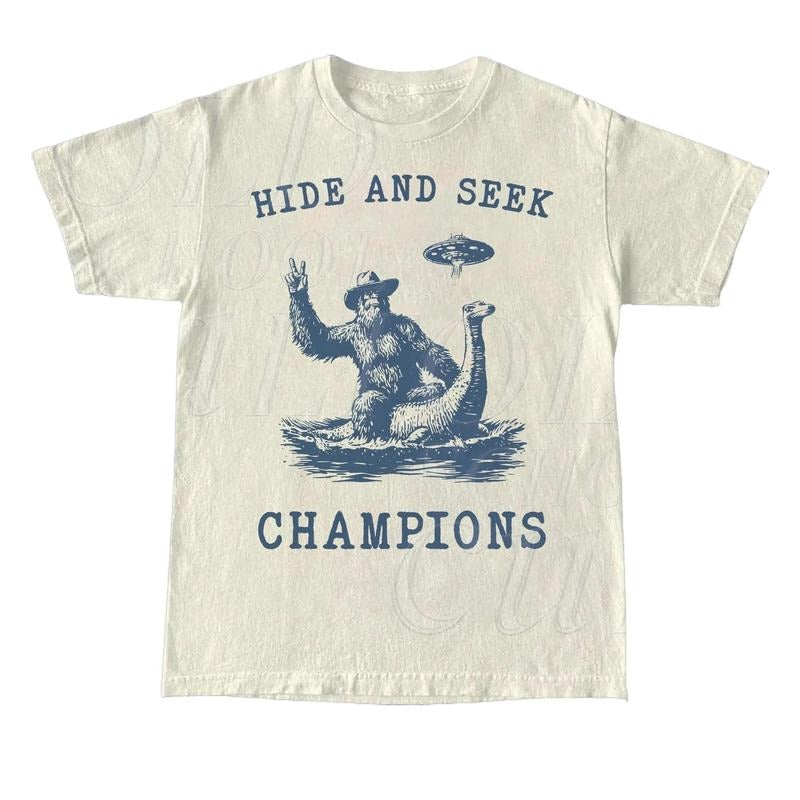 Hide And Seek UFO Shirt, Retro Bigfoot Shirt, Bigfoot Riding Dinosaur Shirt, Space Alien Unisex Relaxed Adult Graphic...