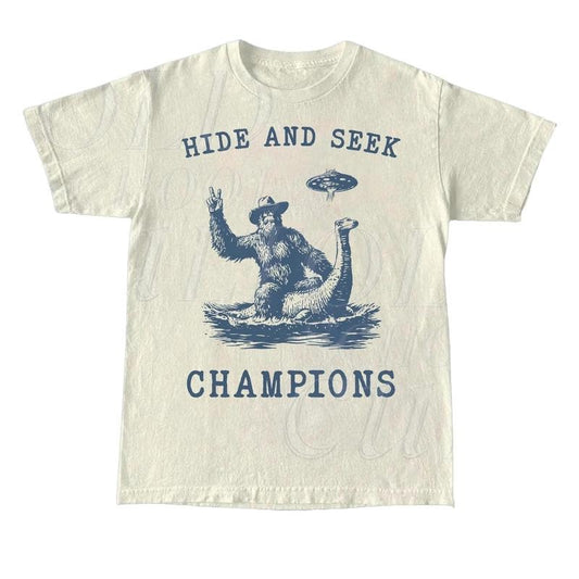 Hide And Seek UFO Shirt, Retro Bigfoot Shirt, Bigfoot Riding Dinosaur Shirt, Space Alien Unisex Relaxed Adult Graphic...