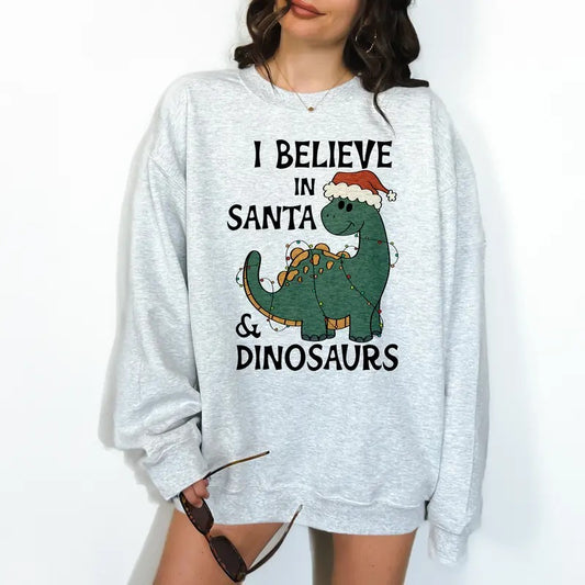 I Believe in Santa and Dinosaurs- Unisex Crewneck Sweatshirt - Print is Sublimation, Funny Tee, Funny Apparel, Gift Idea, Relaxed Fit, Casual Apparel