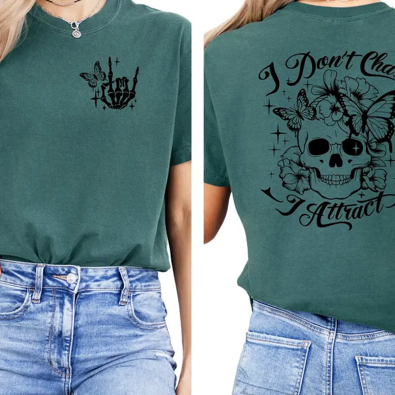 I Don't Chase, I Attract" T-Shirt - Unisex Graphic Tee with Skull & Flowers Design | Motivational Inspirational Quote Shirt | Gothic Style Floral Skull T-Shirt for Women | Casual Comfortable Short Sleeve Top | Gift for Skull Lovers | Trendy Statement Tee