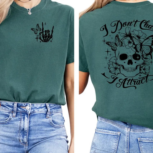 I Don't Chase, I Attract" T-Shirt - Unisex Graphic Tee with Skull & Flowers Design | Motivational Inspirational Quote Shirt | Gothic Style Floral Skull T-Shirt for Women | Casual Comfortable Short Sleeve Top | Gift for Skull Lovers | Trendy Statement Tee