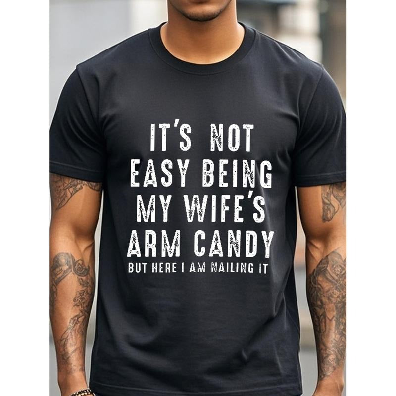 IT'S NOT EASY BEING MY WIFE'S ARM CANDY BUT HERE I AM NAILING IT Funny T-Shirts Crew Neck Casual T-Shirt Mens T-Shirts Black T-Shirts For Men Cotton Soft Breathable 100% Gym-Friendly Running Made in USA