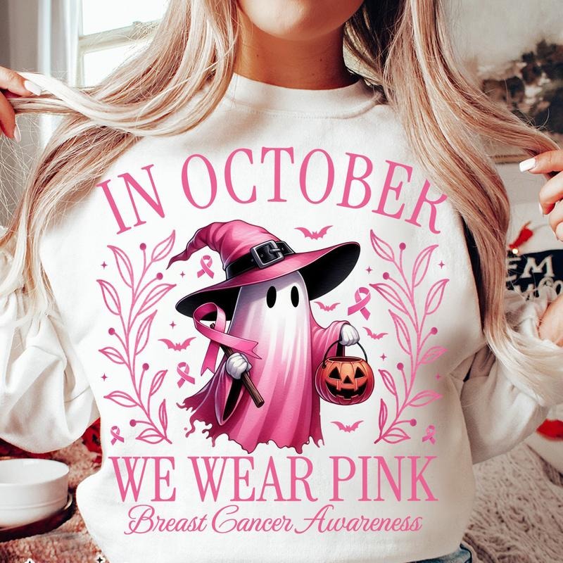 In October We Wear Pink for Breast Cancer Awareness Boo Ghost Holding Pumpkin and Pink Ribbons Crewneck T-shirt Sweatshirt, Breast Cancer Awareness Month Tee, Graphic Design Unisex Cotton T-shirt for Men for Women Menswear Womenswear Top