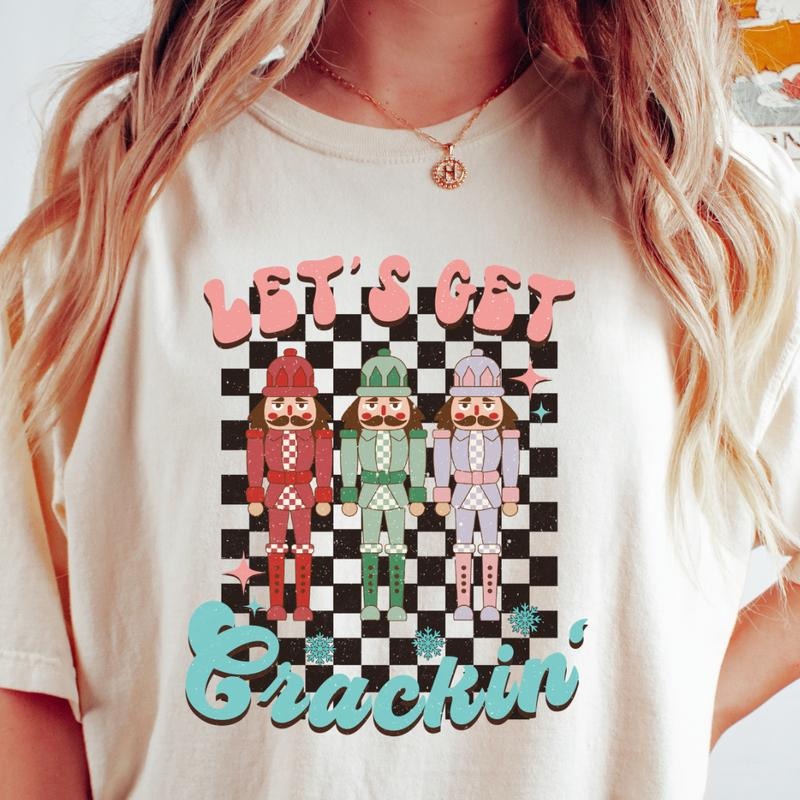 LET'S GET CRACKIN T-SHIRT (COMFORT COLORS T-SHIRT, CASUAL SHIRT UNISEX, CHRISTMAS CLOTHING, GRAPHIC APPAREL, HOLIDAY SHIRT) Cotton Fabric