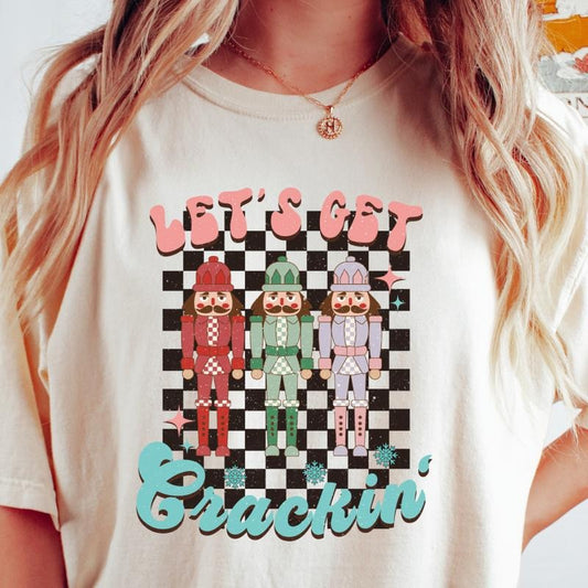 LET'S GET CRACKIN T-SHIRT (COMFORT COLORS T-SHIRT, CASUAL SHIRT UNISEX, CHRISTMAS CLOTHING, GRAPHIC APPAREL, HOLIDAY SHIRT) Cotton Fabric