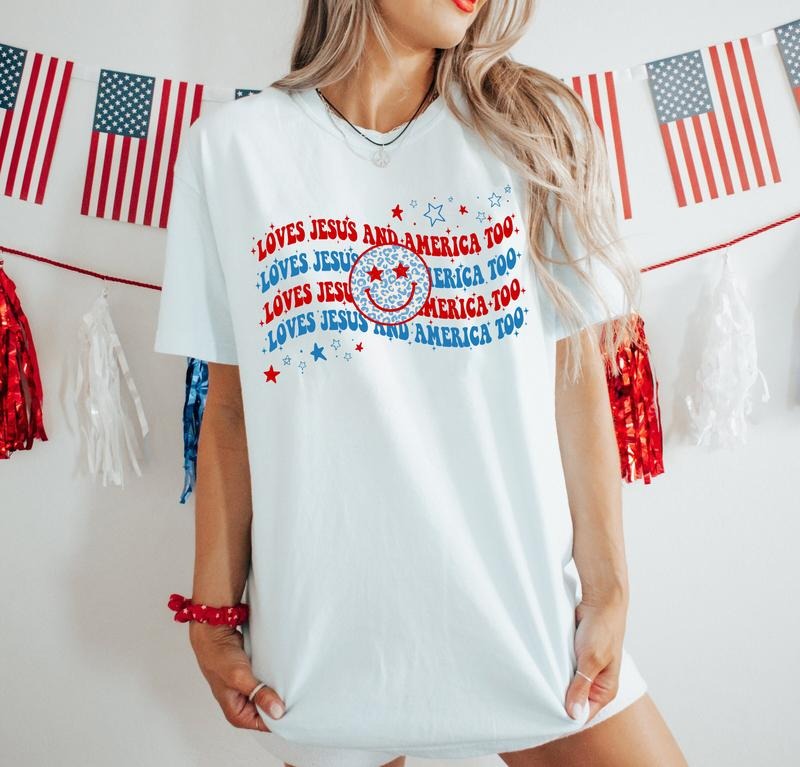 Loves Jesus And America Too Shirt, 4th Of July Shirt, Jesus 4th Of July Shirt, Smile Face Shirt, Independence Day Shirt, Patriotic Shirt, USA Shirt, Red White And Blue Shirt, America Flag Shirt