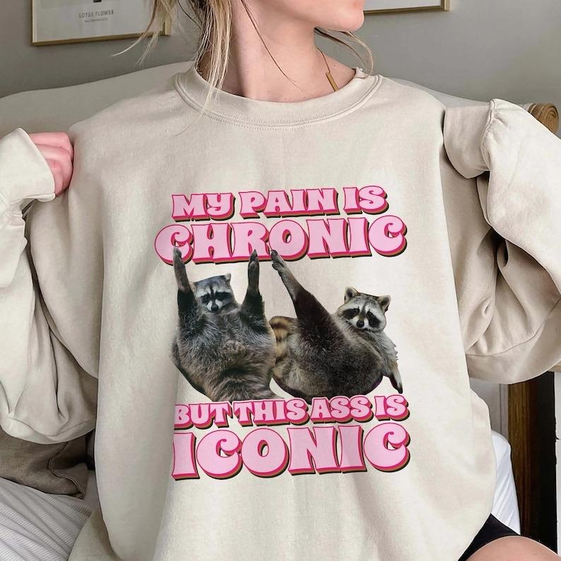 My Pain Is Chronic But This Ass Is Iconic Sweatshirt, Funny Raccoon Meme Sweatshirt, Trending Unisex Tee Sweatshirt,...