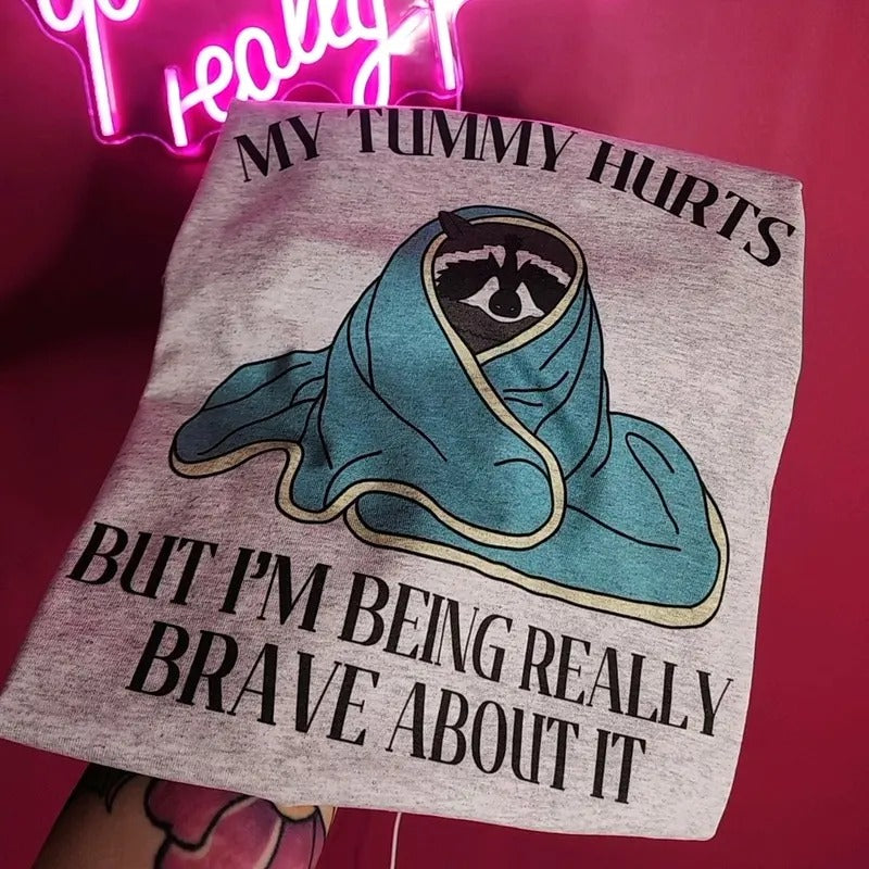 My tummy hurts but I'm being really brave about it Graphic Tee
