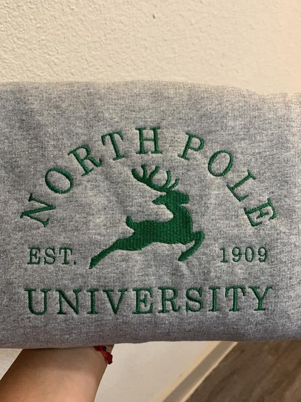 North Pole Embroidered Sweatshirt | Festive Winter Apparel | Cozy Holiday Sweater | Unique Christmas Gift | Embroidered Winter Clothing