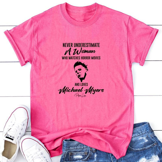Never Underestimate A Woman Who Watches Horror Movies Apparel, Printed In The USA, Tee / Tank / V Neck Gray / White / Blue / Hot Pink / Orange, #sassy #cute #blackprint #100%cotton