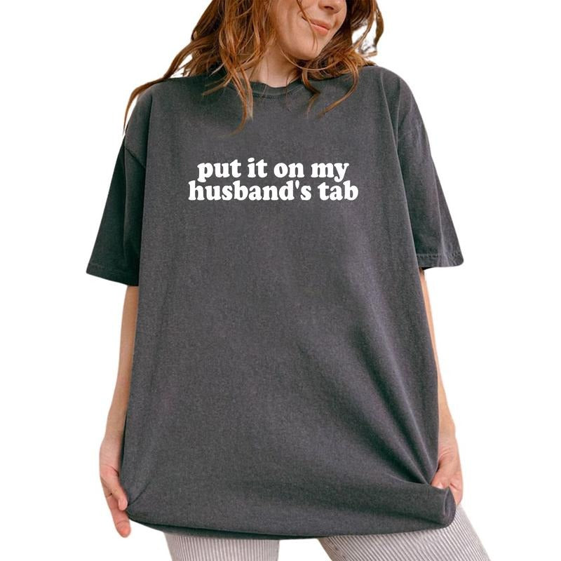 Put It On My Husband's Tab Shirt, Funny Wife Graphic Printed Tee, Sarcastic Wifey Unhinged Shirt, Adult Humor Comfy Fabric Graphic Tee, Wife Life Shirt For Wife, Women's Tops, Womenswear, Cotton Fabric Tee