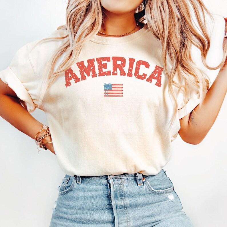Retro America Coquette tshirt, 4th of July shirt, America Checkered tshirt, Memorial Day shirt, Girly USA tshirt, Independence Day shirt, Patriotic , women's shirts, Gift for Mom, Menswear Top, women top, Gift For menswear