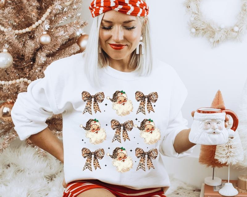 Vintage Leopard Santa with Coquette Bows Crewneck. Relaxed Christmas Unisex Pullover Crewneck Sweatshirt.