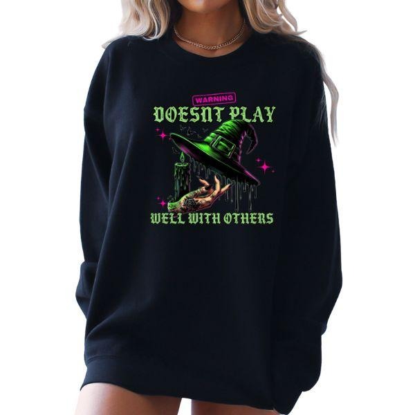 Warning, Doesn't Play Well with Others - Black Halloween Crewneck Sweatshirt with Neon Cauldron, Witches Hat, Bats, and Pumpkins Graphic in Circle Design - Long Sleeve, Unisex Sizing - Traditional Feminine Vibe
