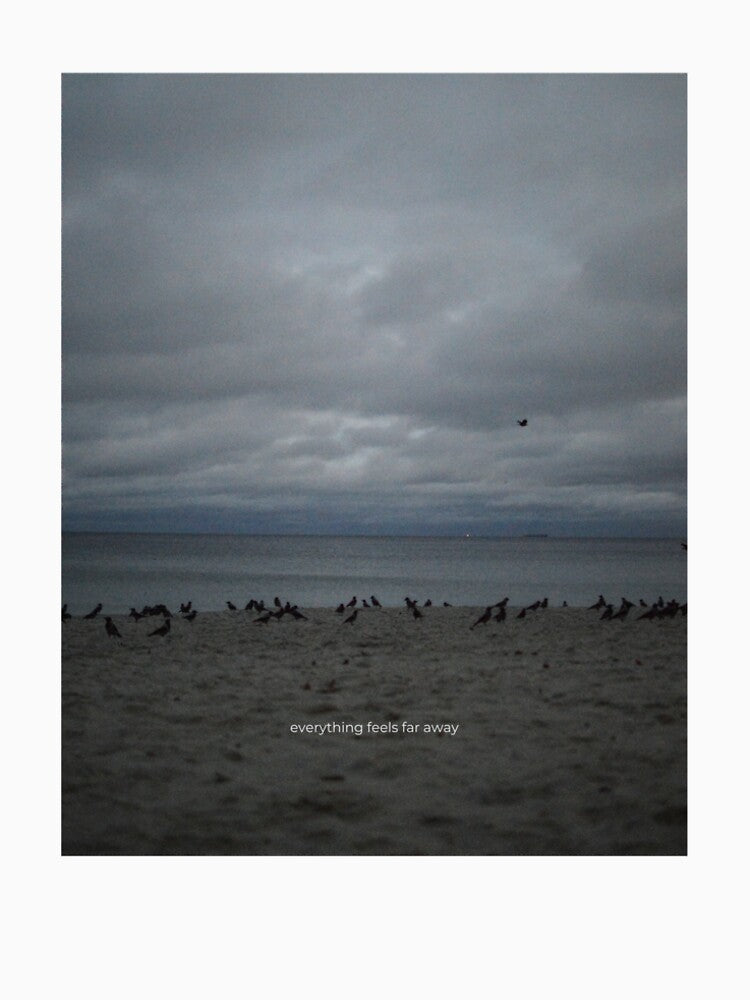 Moody Ocean Aesthetic with Quote “Everything Feels Far Away” by annytsuj