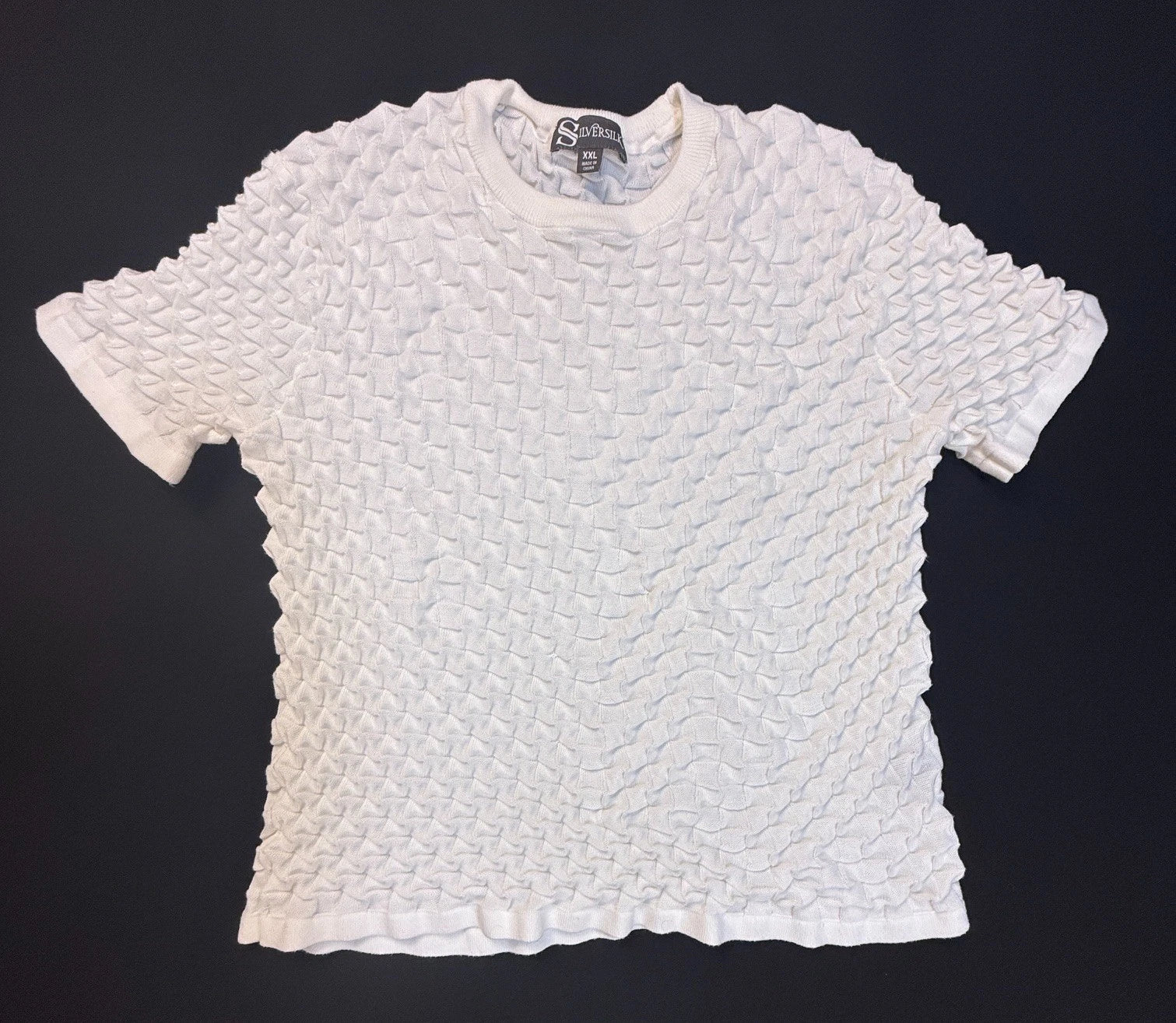 Silversilk textured knit with a raised geometric pattern; white XX (slim)
