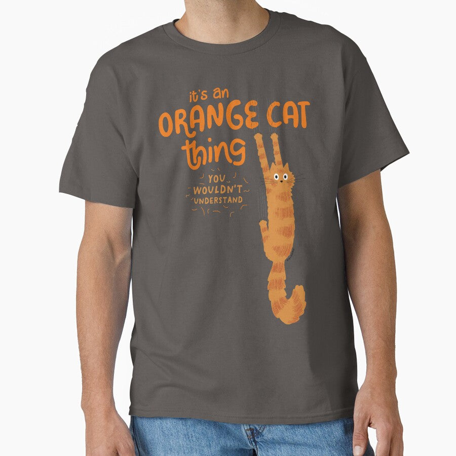 It's An Orange Cat Thing - Funny Tabby Cat Holding On with Claws by Jenn Inashvili